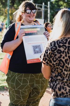 Helper distributing COVID information